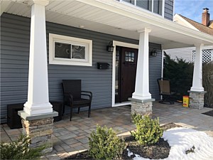 new england real stone pyramid column bases on porch custom masonry